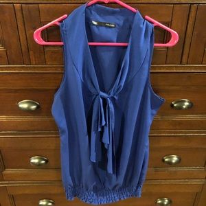 Vibrant blue sleeveless top with bow